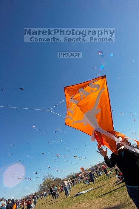 Madhav Tadikonda, class of 1997, and Anjali Patel, class of 1999, fly a UT kite at the 79th annual Zilker Park Kite Festival, Sunday, March 4, 2007.

Filename: SRM_20070304_1537561.jpg
Aperture: f/11.0
Shutter Speed: 1/250
Body: Canon EOS-1D Mark II
Lens: Sigma 15-30mm f/3.5-4.5 EX Aspherical DG DF