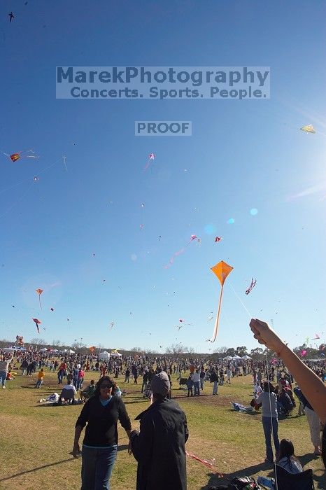 Madhav Tadikonda, class of 1997, and Anjali Patel, class of 1999, fly a UT kite at the 79th annual Zilker Park Kite Festival, Sunday, March 4, 2007.

Filename: SRM_20070304_1540421.jpg
Aperture: f/11.0
Shutter Speed: 1/250
Body: Canon EOS-1D Mark II
Lens: Sigma 15-30mm f/3.5-4.5 EX Aspherical DG DF