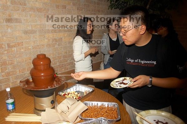 Duke Hwang.  The Asian Business Students Association (ABSA) hosted a chocolate fondue Friday, January 26, 2007 before heading off to a movie premier.

Filename: SRM_20070126_1641446.jpg
Aperture: f/5.6
Shutter Speed: 1/160
Body: Canon EOS 20D
Lens: Canon EF-S 18-55mm f/3.5-5.6