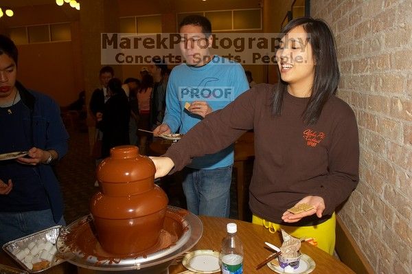 Gloria Sun and Samuel Liu. The Asian Business Students Association (ABSA) hosted a chocolate fondue Friday, January 26, 2007 before heading off to a movie premier.

Filename: SRM_20070126_1650226.jpg
Aperture: f/5.6
Shutter Speed: 1/160
Body: Canon EOS 20D
Lens: Canon EF-S 18-55mm f/3.5-5.6