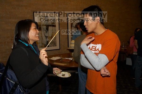 Tina Chien and Eric Chang.  The Asian Business Students Association (ABSA) hosted a chocolate fondue Friday, January 26, 2007 before heading off to a movie premier.

Filename: SRM_20070126_1657249.jpg
Aperture: f/5.6
Shutter Speed: 1/160
Body: Canon EOS 20D
Lens: Canon EF-S 18-55mm f/3.5-5.6