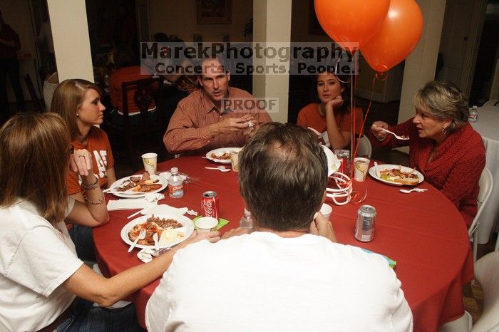 Emily Kleine and her parents, left, enjoy lunch with Liz Colquitt and her parents.  Kappa Kappa Gamma (KKG) hosted a parents' weekend barbecue before the UT vs Nebraska football game on Saturday, October 27, 2007 at their sorority house.

Filename: SRM_20071027_1142504.jpg
Aperture: f/8.0
Shutter Speed: 1/250
Body: Canon EOS 20D
Lens: Canon EF-S 18-55mm f/3.5-5.6