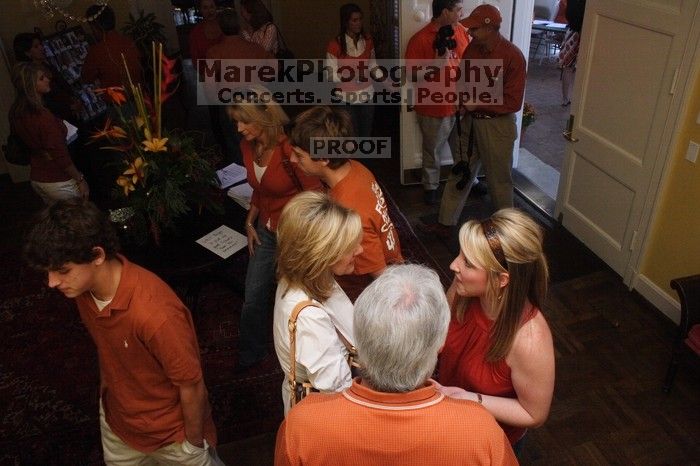 Elizabeth Clinch and her parents.  Kappa Kappa Gamma (KKG) hosted a parents' weekend barbecue before the UT vs Nebraska football game on Saturday, October 27, 2007 at their sorority house.

Filename: SRM_20071027_1155026.jpg
Aperture: f/8.0
Shutter Speed: 1/250
Body: Canon EOS 20D
Lens: Canon EF-S 18-55mm f/3.5-5.6