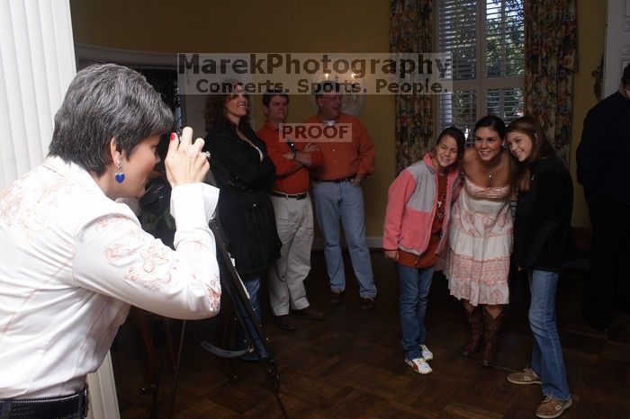 Malorie Liljenwall and her cousins pose as Malorie's mother, who was also a UT Kappa, takes their photo.  Kappa Kappa Gamma (KKG) hosted a parents' weekend barbecue before the UT vs Nebraska football game on Saturday, October 27, 2007 at their sorority hou

Filename: SRM_20071027_1218348.jpg
Aperture: f/8.0
Shutter Speed: 1/200
Body: Canon EOS 20D
Lens: Canon EF-S 18-55mm f/3.5-5.6