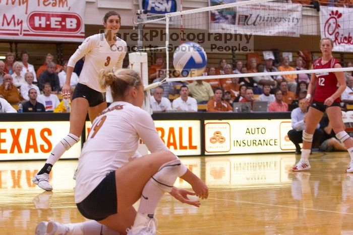 UT sophomore Heather Kisner (#19, DS) waits for the ball as UT junior Lauren Paolini (#3, UTIL) and Nebraska sophomore Rachel Holloway (#12, S) watch.  The Longhorns defeated the Huskers 3-0 on Wednesday night, October 24, 2007 at Gregory Gym.

Filename: SRM_20071024_1842506.jpg
Aperture: f/4.0
Shutter Speed: 1/400
Body: Canon EOS-1D Mark II
Lens: Canon EF 80-200mm f/2.8 L