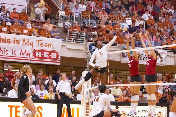 UT sophomore Destinee Hooker (#21, OH) taps the ball past Nebraska junior Jordan Larson (#10, OH) and Nebraska sophomore Kori Cooper (#15, MB) as teammates UT senior Alyson Jennings (#16, L) and UT senior Brandy Magee (#44, MB) watch.  The Longhorns defeat

Filename: SRM_20071024_1900040.jpg
Aperture: f/4.0
Shutter Speed: 1/200
Body: Canon EOS-1D Mark II
Lens: Canon EF 80-200mm f/2.8 L