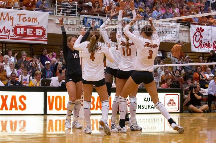 UT senior Alyson Jennings (#16, L), UT senior Michelle Moriarty (#4, S), UT sophomore Destinee Hooker (#21, OH), UT sophomore Ashley Engle (#10, S/RS), and UT junior Lauren Paolini (#3, UTIL) watch.  The Longhorns defeated the Huskers 3-0 on Wednesday nigh

Filename: SRM_20071024_1901323.jpg
Aperture: f/4.0
Shutter Speed: 1/400
Body: Canon EOS-1D Mark II
Lens: Canon EF 80-200mm f/2.8 L