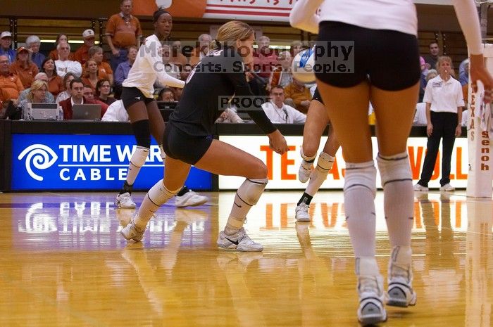 UT senior Alyson Jennings (#16, L) bumps the ball as teammate UT sophomore Destinee Hooker (#21, OH) watches.  The Longhorns defeated the Huskers 3-0 on Wednesday night, October 24, 2007 at Gregory Gym.

Filename: SRM_20071024_1902281.jpg
Aperture: f/4.0
Shutter Speed: 1/400
Body: Canon EOS-1D Mark II
Lens: Canon EF 80-200mm f/2.8 L