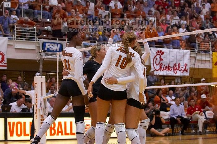 UT sophomore Ashley Engle (#10, S/RS), UT senior Alyson Jennings (#16, L), UT sophomore Destinee Hooker (#21, OH), UT senior Michelle Moriarty (#4, S) and UT freshman Juliann Faucette (#1, OH) celebrate after a point.  The Longhorns defeated the Huskers 3-

Filename: SRM_20071024_1903005.jpg
Aperture: f/4.0
Shutter Speed: 1/400
Body: Canon EOS-1D Mark II
Lens: Canon EF 80-200mm f/2.8 L