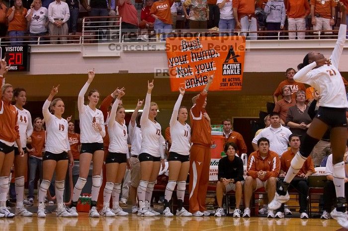 UT sophomore Destinee Hooker (#21, OH) serves the ball as teammates UT senior Brandy Magee (#44, MB), UT sophomore Heather Kisner (#19, DS), UT freshman Jennifer Doris (#8, UTIL), UT freshman Chelsey Klein (#9, DS), UT freshman Alexandra Lewis (#12, DS) an

Filename: SRM_20071024_1903220.jpg
Aperture: f/4.0
Shutter Speed: 1/400
Body: Canon EOS-1D Mark II
Lens: Canon EF 80-200mm f/2.8 L