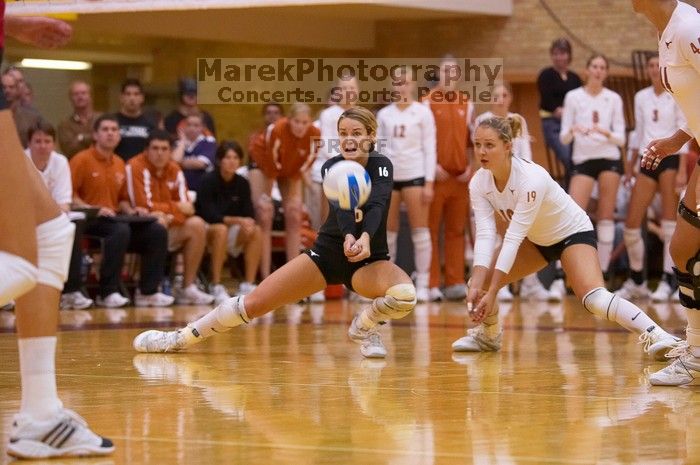 UT senior Alyson Jennings (#16, L) hits the ball as UT sophomore Heather Kisner (#19, DS) watches.  The Longhorns defeated the Huskers 3-0 on Wednesday night, October 24, 2007 at Gregory Gym.

Filename: SRM_20071024_1917289.jpg
Aperture: f/3.5
Shutter Speed: 1/400
Body: Canon EOS-1D Mark II
Lens: Canon EF 80-200mm f/2.8 L