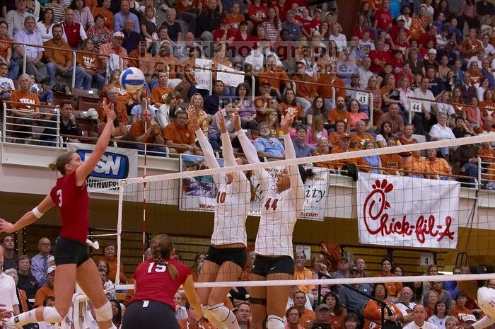 UT sophomore Ashley Engle (#10, S/RS) and UT senior Brandy Magee (#44, MB) block a hit by Nebraska senior Christina Houghtelling (#3, OH) as Nebraska sophomore Kori Cooper (#15, MB) watches.  The Longhorns defeated the Huskers 3-0 on Wednesday night, Octob

Filename: SRM_20071024_1919322.jpg
Aperture: f/4.0
Shutter Speed: 1/400
Body: Canon EOS-1D Mark II
Lens: Canon EF 80-200mm f/2.8 L