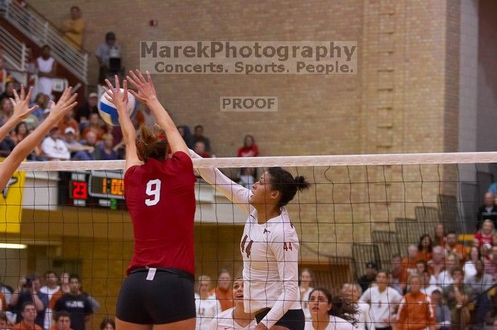 UT senior Brandy Magee (#44, MB) hits the ball as Nebraska senior Sarah Pavan (#9, RS) attempts to block.  The Longhorns defeated the Huskers 3-0 on Wednesday night, October 24, 2007 at Gregory Gym.

Filename: SRM_20071024_1928047.jpg
Aperture: f/4.0
Shutter Speed: 1/400
Body: Canon EOS-1D Mark II
Lens: Canon EF 80-200mm f/2.8 L