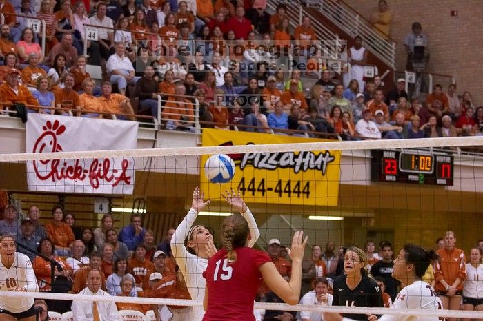 UT senior Michelle Moriarty (#4, S) sets the ball for UT sophomore Ashley Engle (#10, S/RS) as UT senior Alyson Jennings (#16, L), UT senior Brandy Magee (#44, MB) and Nebraska sophomore Kori Cooper (#15, MB) watch.  The Longhorns defeated the Huskers 3-0

Filename: SRM_20071024_1928081.jpg
Aperture: f/4.0
Shutter Speed: 1/400
Body: Canon EOS-1D Mark II
Lens: Canon EF 80-200mm f/2.8 L