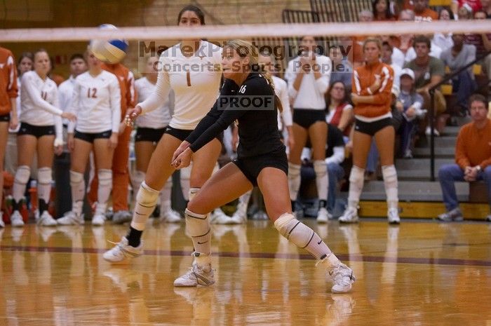 UT senior Alyson Jennings (#16, L) bumps the ball as UT freshman Juliann Faucette (#1, OH) watches.  The Longhorns defeated the Huskers 3-0 on Wednesday night, October 24, 2007 at Gregory Gym.

Filename: SRM_20071024_1928447.jpg
Aperture: f/4.0
Shutter Speed: 1/400
Body: Canon EOS-1D Mark II
Lens: Canon EF 80-200mm f/2.8 L