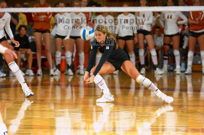 UT senior Alyson Jennings (#16, L) hits the ball.  The Longhorns defeated the Huskers 3-0 on Wednesday night, October 24, 2007 at Gregory Gym.

Filename: SRM_20071024_1931508.jpg
Aperture: f/4.0
Shutter Speed: 1/400
Body: Canon EOS-1D Mark II
Lens: Canon EF 80-200mm f/2.8 L