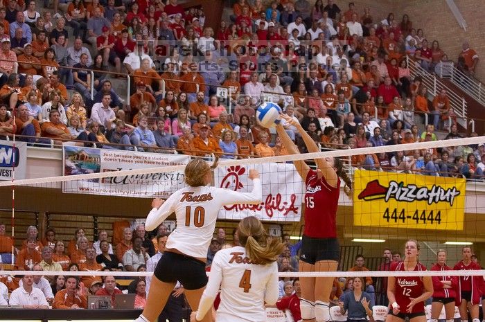 Nebraska sophomore Kori Cooper (#15, MB) blocks a hit by UT sophomore Ashley Engle (#10, S/RS) as UT senior Michelle Moriarty (#4, S) and Nebraska sophomore Rachel Holloway (#12, S) watch.  The Longhorns defeated the Huskers 3-0 on Wednesday night, October

Filename: SRM_20071024_2005307.jpg
Aperture: f/4.0
Shutter Speed: 1/320
Body: Canon EOS-1D Mark II
Lens: Canon EF 80-200mm f/2.8 L