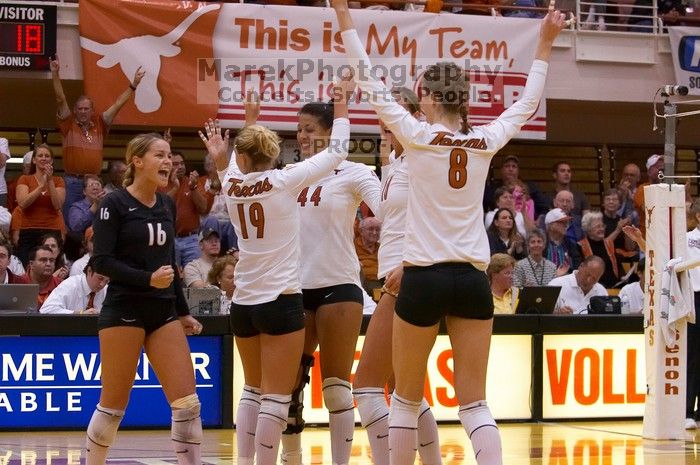 UT senior Alyson Jennings (#16, L), UT sophomore Heather Kisner (#19, DS), UT senior Brandy Magee (#44, MB), UT sophomore Ashley Engle (#10, S/RS) and UT freshman Jennifer Doris (#8, UTIL) celebrate after a point.  The Longhorns defeated the Huskers 3-0 on

Filename: SRM_20071024_2010527.jpg
Aperture: f/4.0
Shutter Speed: 1/400
Body: Canon EOS-1D Mark II
Lens: Canon EF 80-200mm f/2.8 L