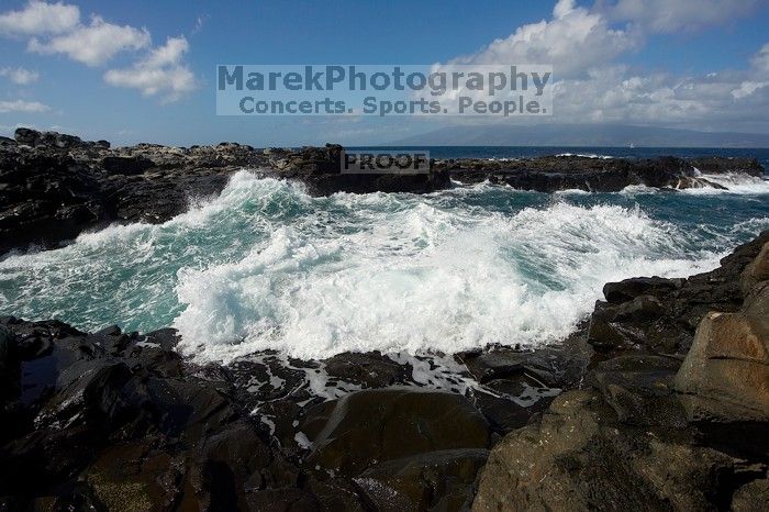 Hike to the Nakalele blowholes along the surf-beaten lava formations.

Filename: SRM_20071219_1227065.jpg
Aperture: f/8.0
Shutter Speed: 1/5000
Body: Canon EOS-1D Mark II
Lens: Sigma 15-30mm f/3.5-4.5 EX Aspherical DG DF