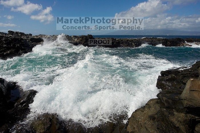 Hike to the Nakalele blowholes along the surf-beaten lava formations.

Filename: SRM_20071219_1227079.jpg
Aperture: f/8.0
Shutter Speed: 1/5000
Body: Canon EOS-1D Mark II
Lens: Sigma 15-30mm f/3.5-4.5 EX Aspherical DG DF