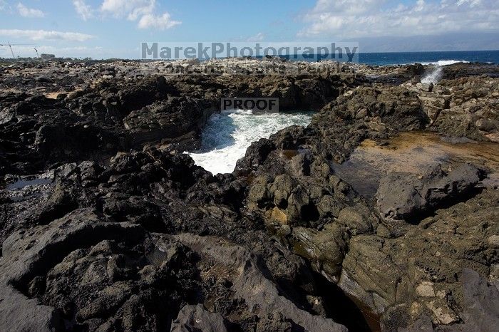 Hike to the Nakalele blowholes along the surf-beaten lava formations.

Filename: SRM_20071219_1229429.jpg
Aperture: f/8.0
Shutter Speed: 1/2500
Body: Canon EOS-1D Mark II
Lens: Sigma 15-30mm f/3.5-4.5 EX Aspherical DG DF