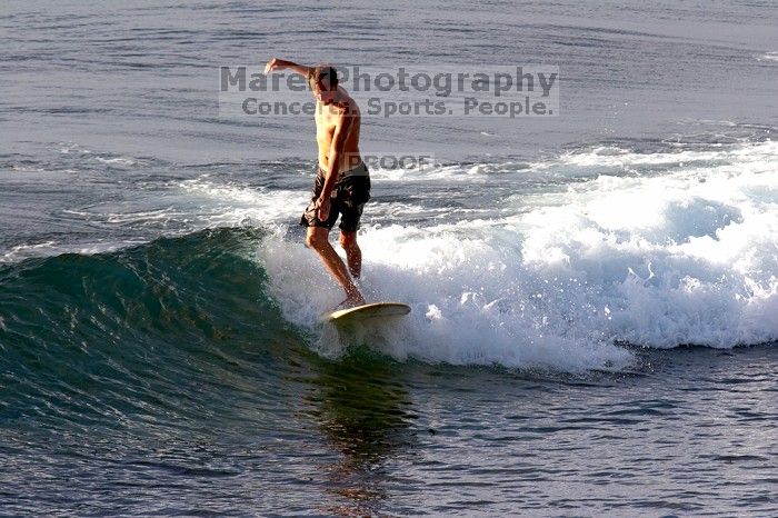 Surfers in Honolua Bay, Maui, Hawai'i, 2007.

Filename: SRM_20071217_1628226.jpg
Aperture: f/8.0
Shutter Speed: 1/1000
Body: Canon EOS 20D
Lens: Canon EF 300mm f/2.8 L IS