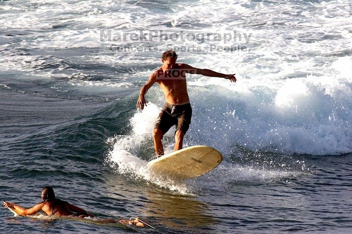 Surfers in Honolua Bay, Maui, Hawai'i, 2007.

Filename: SRM_20071217_1628250.jpg
Aperture: f/8.0
Shutter Speed: 1/1000
Body: Canon EOS 20D
Lens: Canon EF 300mm f/2.8 L IS