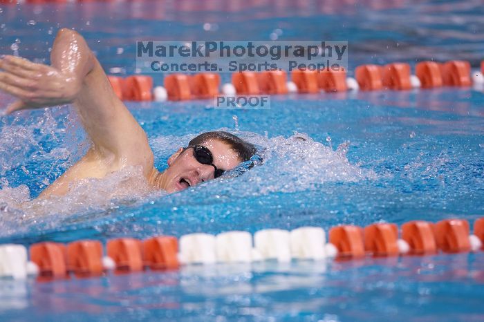 UT junior Michael Klueh won the 1000 yard freestyle with a time of 9:01.89.  The University of Texas Longhorns defeated The University of Georgia Bulldogs 157-135 on Saturday, January 12, 2008.

Filename: SRM_20080112_1107580.jpg
Aperture: f/2.8
Shutter Speed: 1/400
Body: Canon EOS-1D Mark II
Lens: Canon EF 300mm f/2.8 L IS