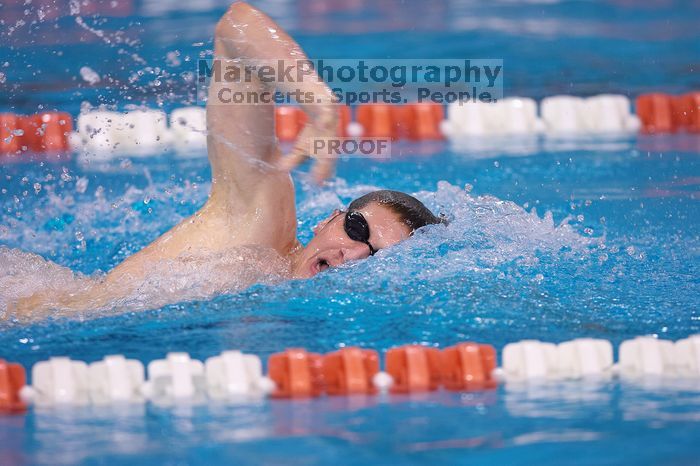 UT junior Michael Klueh won the 1000 yard freestyle with a time of 9:01.89.  The University of Texas Longhorns defeated The University of Georgia Bulldogs 157-135 on Saturday, January 12, 2008.

Filename: SRM_20080112_1108524.jpg
Aperture: f/2.8
Shutter Speed: 1/400
Body: Canon EOS-1D Mark II
Lens: Canon EF 300mm f/2.8 L IS