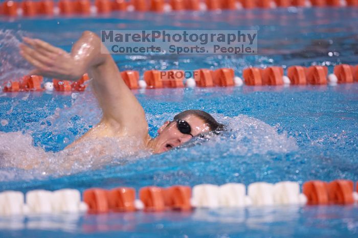 UT junior Michael Klueh won the 1000 yard freestyle with a time of 9:01.89.  The University of Texas Longhorns defeated The University of Georgia Bulldogs 157-135 on Saturday, January 12, 2008.

Filename: SRM_20080112_1108546.jpg
Aperture: f/2.8
Shutter Speed: 1/400
Body: Canon EOS-1D Mark II
Lens: Canon EF 300mm f/2.8 L IS