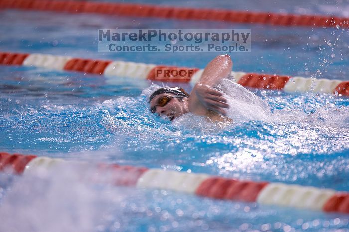 UT junior Michael Klueh won the 1000 yard freestyle with a time of 9:01.89.  The University of Texas Longhorns defeated The University of Georgia Bulldogs 157-135 on Saturday, January 12, 2008.

Filename: SRM_20080112_1111146.jpg
Aperture: f/2.8
Shutter Speed: 1/400
Body: Canon EOS-1D Mark II
Lens: Canon EF 300mm f/2.8 L IS