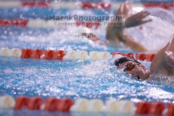 UT sophomore Trey Hoover took fifth in the 1000 yard freestyle with a time of 9:47.70.  The University of Texas Longhorns defeated The University of Georgia Bulldogs 157-135 on Saturday, January 12, 2008.

Filename: SRM_20080112_1112342.jpg
Aperture: f/2.8
Shutter Speed: 1/400
Body: Canon EOS-1D Mark II
Lens: Canon EF 300mm f/2.8 L IS