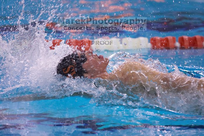 UT senior Daniel Rohleder took first in the 100 yard backstroke with a time of 9:11.44.  The University of Texas Longhorns defeated The University of Georgia Bulldogs 157-135 on Saturday, January 12, 2008.

Filename: SRM_20080112_1122489.jpg
Aperture: f/2.8
Shutter Speed: 1/400
Body: Canon EOS-1D Mark II
Lens: Canon EF 300mm f/2.8 L IS