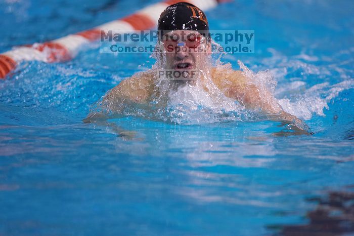 UT senior Agustin Magruder took second in the 100 yard breaststroke with a time of 56.67.  The University of Texas Longhorns defeated The University of Georgia Bulldogs 157-135 on Saturday, January 12, 2008.

Filename: SRM_20080112_1124567.jpg
Aperture: f/2.8
Shutter Speed: 1/400
Body: Canon EOS-1D Mark II
Lens: Canon EF 300mm f/2.8 L IS