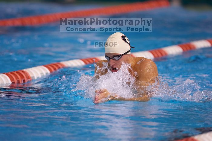 Georgia's Ashley Oliver was disqualified from the 200 yard breaststroke.  The University of Texas Longhorns defeated The University of Georgia Bulldogs 157-135 on Saturday, January 12, 2008.

Filename: SRM_20080112_1201042.jpg
Aperture: f/2.8
Shutter Speed: 1/400
Body: Canon EOS-1D Mark II
Lens: Canon EF 300mm f/2.8 L IS