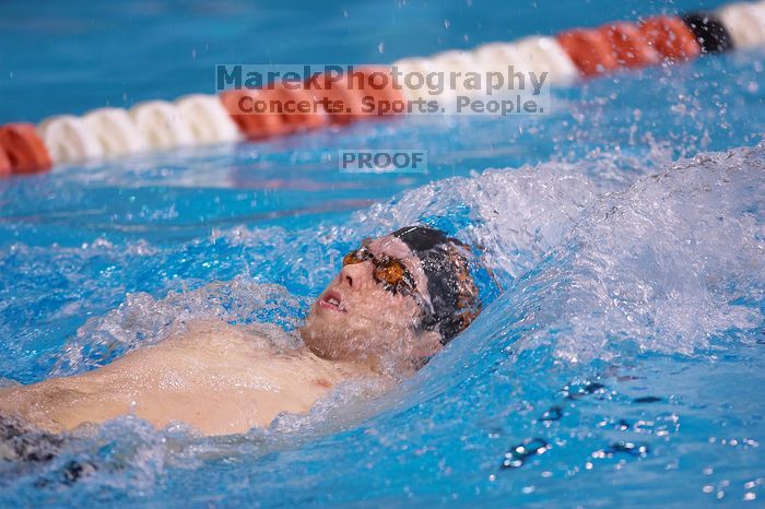 UT sophomore Trey Hoover competed in the 400 yard IM with a time of 4:10.06.  The University of Texas Longhorns defeated The University of Georgia Bulldogs 157-135 on Saturday, January 12, 2008.

Filename: SRM_20080112_1239049.jpg
Aperture: f/2.8
Shutter Speed: 1/400
Body: Canon EOS-1D Mark II
Lens: Canon EF 300mm f/2.8 L IS