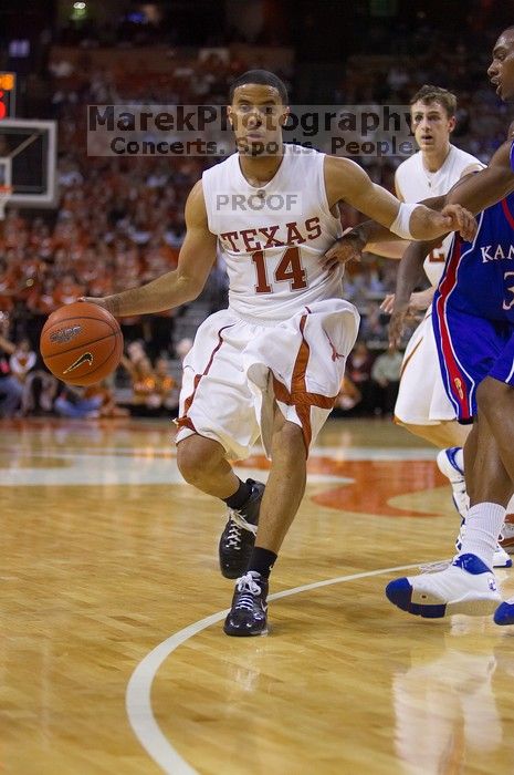 UT sophomore D.J. Augustin (#14, G) makes a drive.  The University of Texas (UT) Longhorns defeated the University of Kansas Jayhawks 72-69 in Austin, Texas on Monday, February 11, 2008.

Filename: SRM_20080211_2135087.jpg
Aperture: f/2.8
Shutter Speed: 1/640
Body: Canon EOS-1D Mark II
Lens: Canon EF 80-200mm f/2.8 L