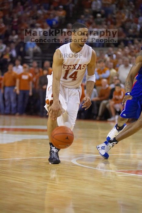 UT junior A.J. Abrams (#3, G) playing defense against a Kansas player.  The University of Texas (UT) Longhorns defeated the University of Kansas Jayhawks 72-69 in Austin, Texas on Monday, February 11, 2008.

Filename: SRM_20080211_2153202.jpg
Aperture: f/2.8
Shutter Speed: 1/640
Body: Canon EOS-1D Mark II
Lens: Canon EF 80-200mm f/2.8 L