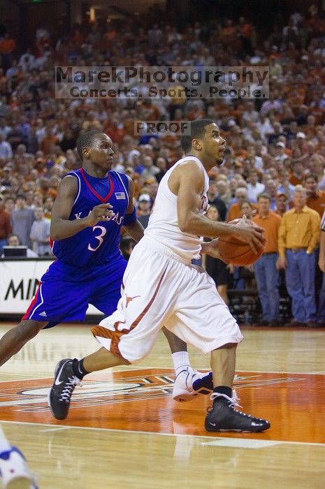 UT junior A.J. Abrams (#3, G) playing defense against a Kansas player.  The University of Texas (UT) Longhorns defeated the University of Kansas Jayhawks 72-69 in Austin, Texas on Monday, February 11, 2008.

Filename: SRM_20080211_2158226.jpg
Aperture: f/2.8
Shutter Speed: 1/640
Body: Canon EOS-1D Mark II
Lens: Canon EF 80-200mm f/2.8 L