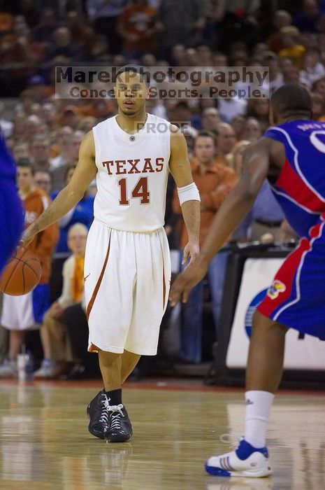 UT junior A.J. Abrams (#3, G) playing defense against a Kansas player.  The University of Texas (UT) Longhorns defeated the University of Kansas Jayhawks 72-69 in Austin, Texas on Monday, February 11, 2008.

Filename: SRM_20080211_2206269.jpg
Aperture: f/2.8
Shutter Speed: 1/640
Body: Canon EOS-1D Mark II
Lens: Canon EF 80-200mm f/2.8 L