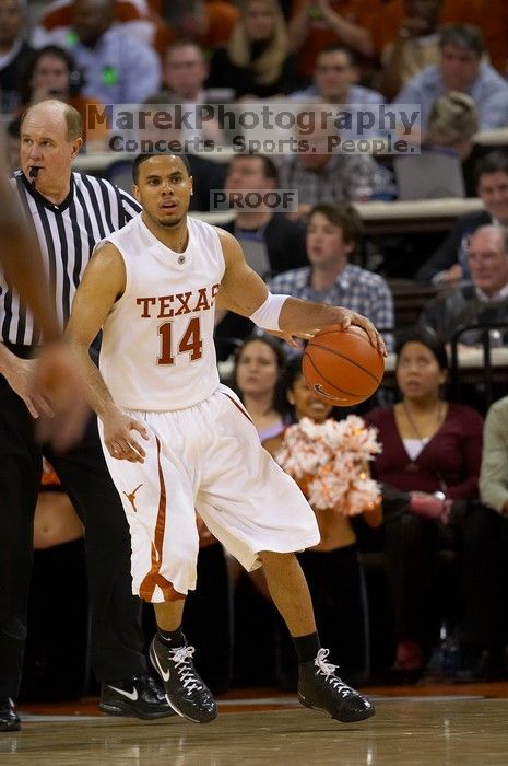 UT junior A.J. Abrams (#3, G) playing defense against a Kansas player.  The University of Texas (UT) Longhorns defeated the University of Kansas Jayhawks 72-69 in Austin, Texas on Monday, February 11, 2008.

Filename: SRM_20080211_2209221.jpg
Aperture: f/2.8
Shutter Speed: 1/640
Body: Canon EOS 20D
Lens: Canon EF 300mm f/2.8 L IS