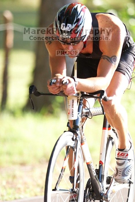 Philip Mallory (bib #79) of Round Rock placed 10 in his age group (M 35-39) with an overall time of 01:54:53 at The Howdy Du duathlon in Berry Springs Park, Georgetown, Sunday July 6, 2008.

Filename: SRM_20080706_0802048.jpg
Aperture: f/2.8
Shutter Speed: 1/800
Body: Canon EOS 20D
Lens: Canon EF 300mm f/2.8 L IS