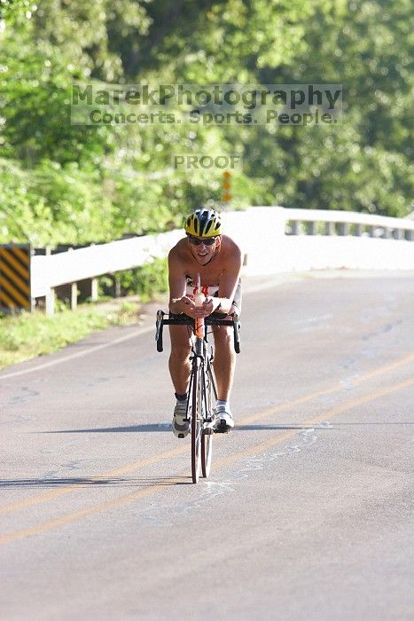 James Ornelas (bib #84) of Austin placed 2 in his age group (M 25-29) with an overall time of 01:27:33 at The Howdy Du duathlon in Berry Springs Park, Georgetown, Sunday July 6, 2008.

Filename: SRM_20080706_0804021.jpg
Aperture: f/5.0
Shutter Speed: 1/500
Body: Canon EOS 20D
Lens: Canon EF 300mm f/2.8 L IS