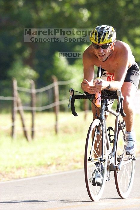 James Ornelas (bib #84) of Austin placed 2 in his age group (M 25-29) with an overall time of 01:27:33 at The Howdy Du duathlon in Berry Springs Park, Georgetown, Sunday July 6, 2008.

Filename: SRM_20080706_0804063.jpg
Aperture: f/5.0
Shutter Speed: 1/500
Body: Canon EOS 20D
Lens: Canon EF 300mm f/2.8 L IS