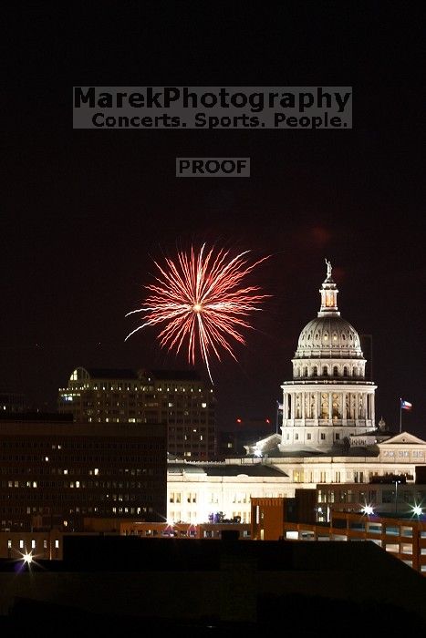 Austin Independence Day fireworks with the Capitol building, as viewed from atop the Manor Garage at The University of Texas at Austin.  The fireworks were launched from Auditorium Shores, downtown Austin, Friday, July 4, 2008.

Filename: SRM_20080704_2141344.jpg
Aperture: f/11.0
Shutter Speed: 6/1
Body: Canon EOS 20D
Lens: Canon EF 80-200mm f/2.8 L