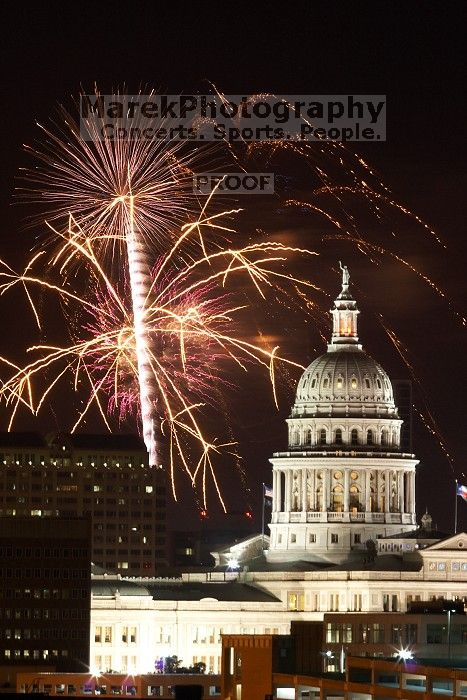 Austin Independence Day fireworks with the Capitol building, as viewed from atop the Manor Garage at The University of Texas at Austin.  The fireworks were launched from Auditorium Shores, downtown Austin, Friday, July 4, 2008.

Filename: SRM_20080704_2142227.jpg
Aperture: f/11.0
Shutter Speed: 6/1
Body: Canon EOS 20D
Lens: Canon EF 80-200mm f/2.8 L