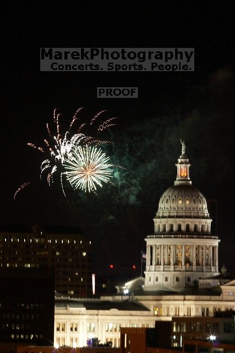 Austin Independence Day fireworks with the Capitol building, as viewed from atop the Manor Garage at The University of Texas at Austin.  The fireworks were launched from Auditorium Shores, downtown Austin, Friday, July 4, 2008.

Filename: SRM_20080704_2148524.jpg
Aperture: f/11.0
Shutter Speed: 2/1
Body: Canon EOS 20D
Lens: Canon EF 80-200mm f/2.8 L