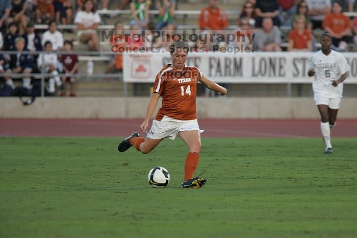 UT senior Kasey Moore (#14, Defender) clears the ball.  The University of Texas women's soccer team tied 0-0 against the Texas A&M Aggies Friday night, September 27, 2008.

Filename: SRM_20080926_1909087.jpg
Aperture: f/4.0
Shutter Speed: 1/800
Body: Canon EOS-1D Mark II
Lens: Canon EF 300mm f/2.8 L IS