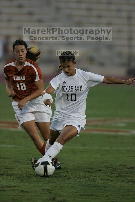 UT senior Stephanie Logterman (#10, Defender).  The University of Texas women's soccer team tied 0-0 against the Texas A&M Aggies Friday night, September 27, 2008.

Filename: SRM_20080926_1914522.jpg
Aperture: f/4.0
Shutter Speed: 1/800
Body: Canon EOS-1D Mark II
Lens: Canon EF 300mm f/2.8 L IS