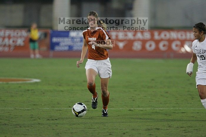 UT senior Jill Gilbeau (#4, Defender and Midfielder).  The University of Texas women's soccer team tied 0-0 against the Texas A&M Aggies Friday night, September 27, 2008.

Filename: SRM_20080926_1922225.jpg
Aperture: f/4.0
Shutter Speed: 1/500
Body: Canon EOS-1D Mark II
Lens: Canon EF 300mm f/2.8 L IS